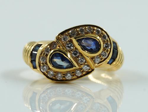 SAPPHIRE AND DIAMOND CROSS OVER RING