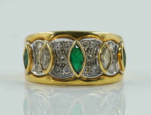 AN EMERALD AND DIAMOND RING