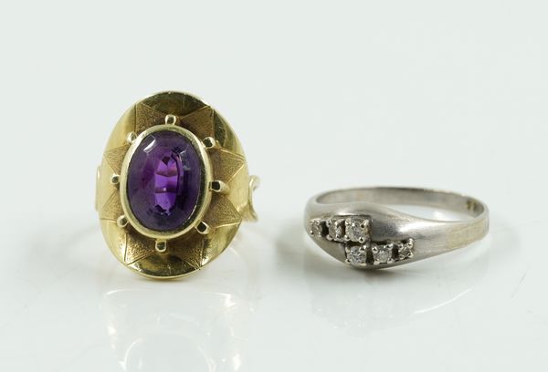 A DIAMOND RING AND AN AMETHYST RING