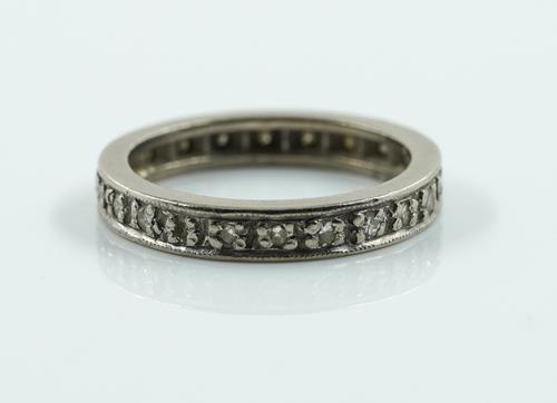 A WHITE GOLD AND DIAMOND FULL ETERNITY RING