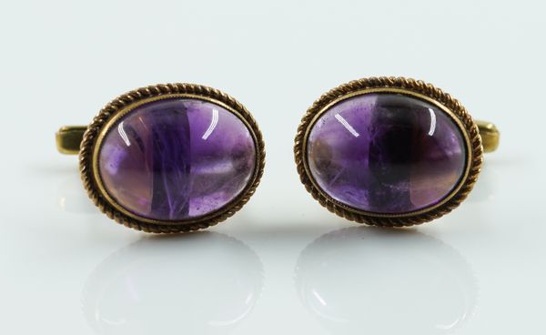 A PAIR OF 9CT GOLD AND CABOCHON AMETHYST CUFFLINKS