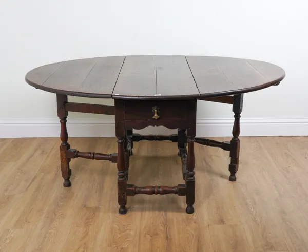 A 17TH CENTURY AND LATER OAK GATELEG DINING TABLE