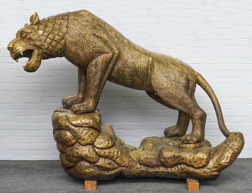 A LARGE GILT-METAL ASIAN TIGER