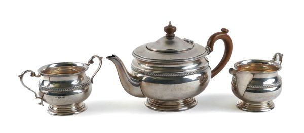 A SILVER THREE PIECE TEA SET