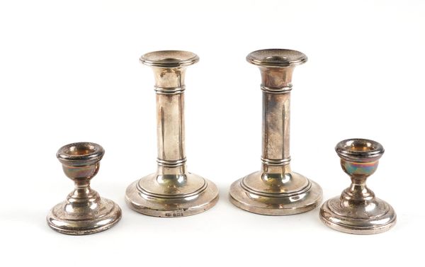 TWO PAIRS OF SILVER CANDLESTICKS (2)