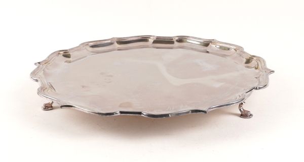 A SILVER SHAPED CIRCULAR SALVER