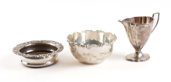 A SILVER MOUNTED COASTER, A SILVER SUGAR BOWL AND A SILVER CREAM JUG (3)