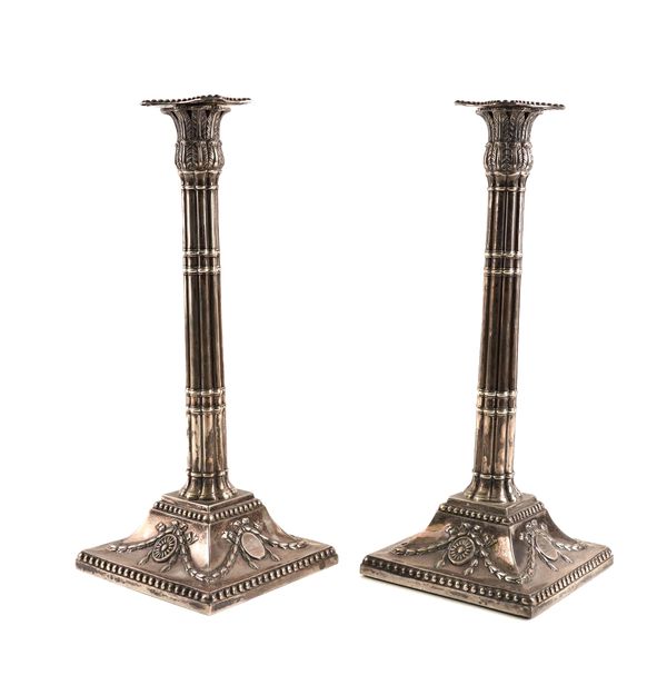 A PAIR OF SILVER TABLE CANDLESTICKS