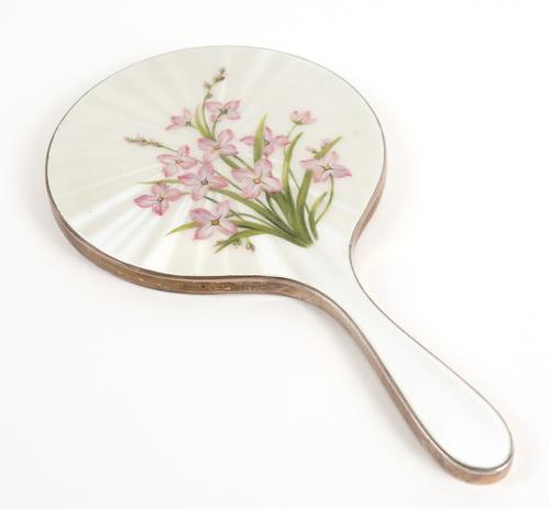 A SILVER AND ENAMELLED HAND MIRROR