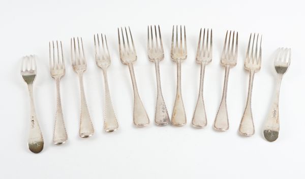 TEN SILVER AND ONE FURTHER FEATHER EDGED OLD ENGLISH PATTERN TABLE FORKS (11)