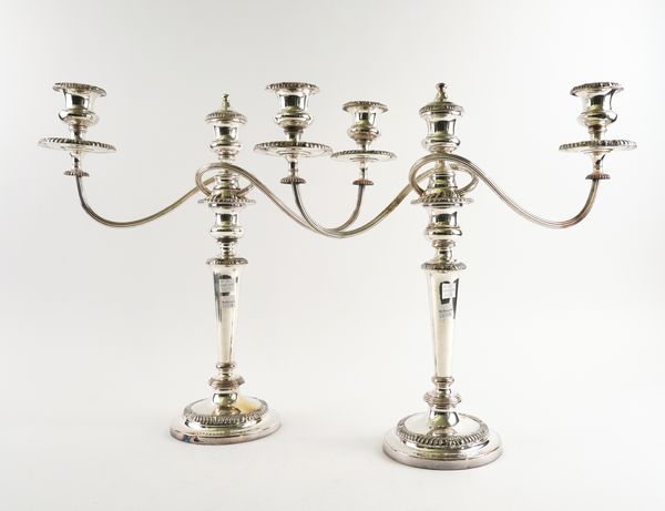 A  PAIR OF SHEFFIELD PLATED THREE LIGHT TABLE CANDELABRA (2)