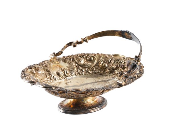 A LATE VICTORIAN SILVER CAKE OR FRUIT BASKET