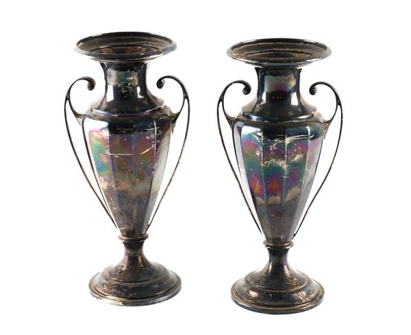 A PAIR OF SILVER TWIN HANDLED VASES (2)