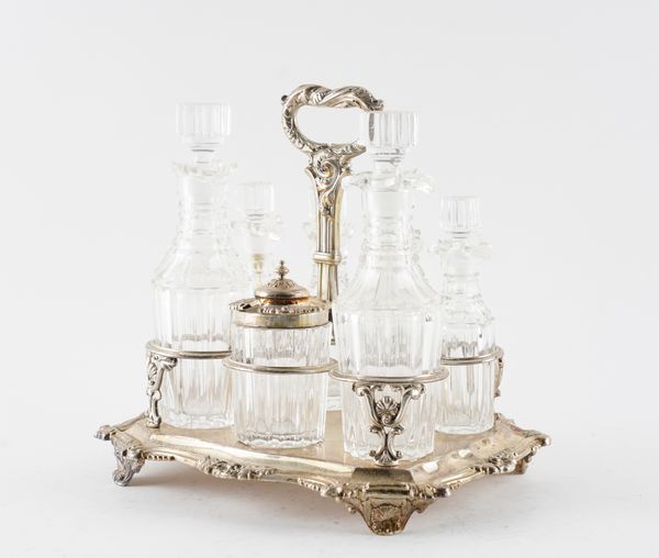 A LATE GEORGE IV SILVER SEVEN BOTTLE CRUET FRAME