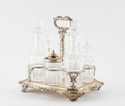 A LATE GEORGE IV SILVER SEVEN BOTTLE CRUET FRAME