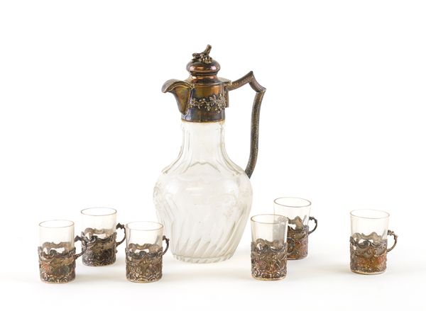 A SILVER MOUNTED LIQUEUR DECANTER AND SIX TOTS