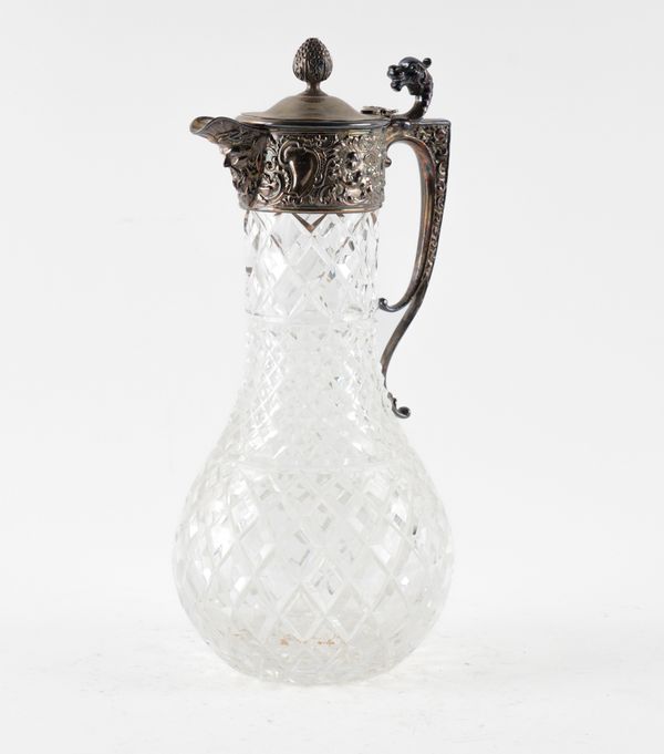 A SILVER MOUNTED FACETED GLASS CLARET JUG