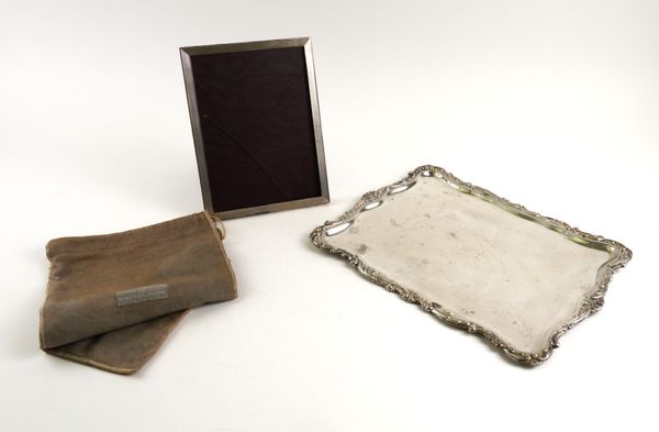 A SPANISH DRESSING TABLE TRAY AND A SILVER MOUNTED PHOTOGRAPH FRAME (2)