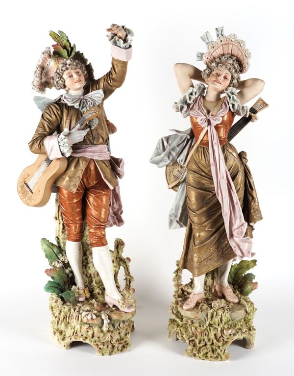 A LARGE PAIR OF CONTINENTAL PORCELAIN FIGURES OF MUSICIANS (2)