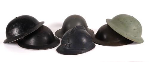 A GROUP OF WORLD WAR HELMETS INCLUDING A FRENCH WORLD WAR ONE HELMET (6)