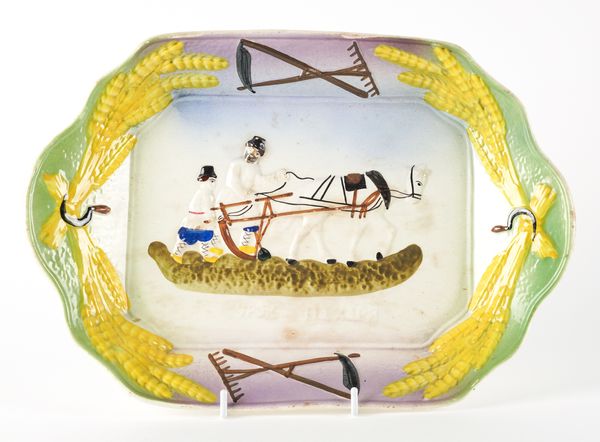 A RUSSIAN `PLOWMAN'S LESSON' EARTHENWARE TRAY