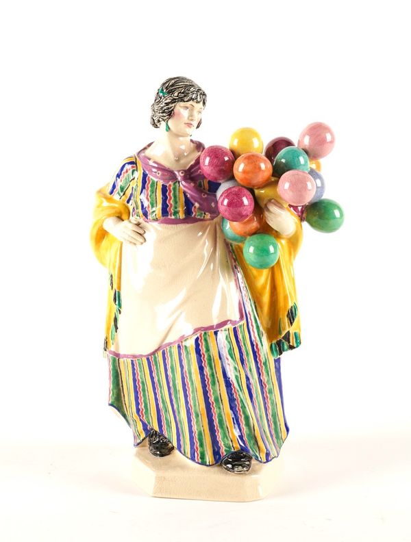 A CHARLES VYSE EARTHENWARE FIGURE OF `THE BALLOON WOMAN'