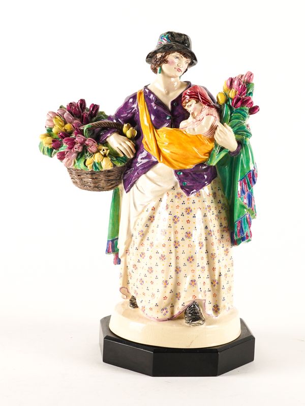 A CHARLES VYSE EARTHENWARE FIGURE OF `THE TULIP WOMAN'