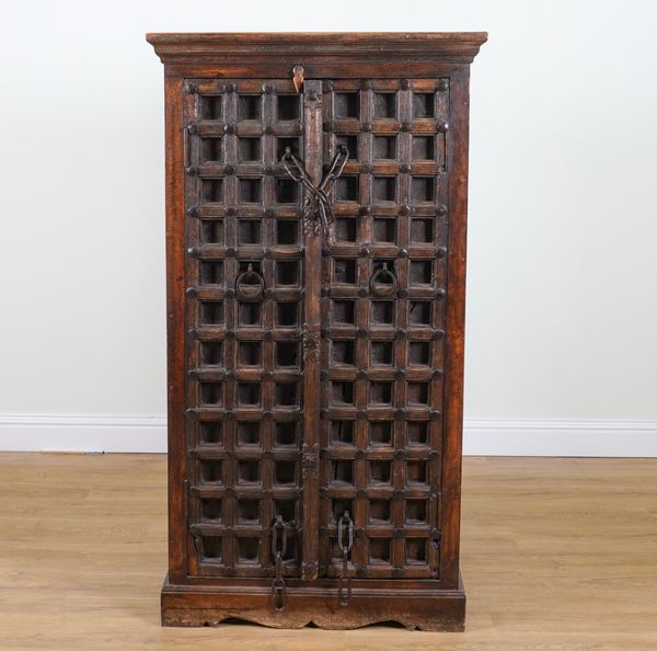 A MODERN INDIAN IRON STUDDED HARDWOOD CUPBOARD