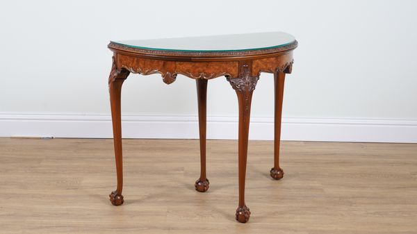 A GEORGE I STYLE WALNUT FOLD-OVER DEMI-LUNE CARD TABLE