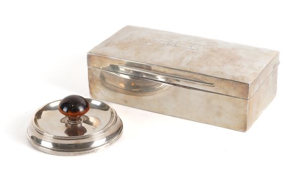 A SILVER RECTANGULAR CIGARETTE BOX AND A SILVER MOUNTED PAPERWEIGHT (2)