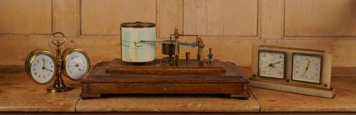 AN EDWARDIAN MAHOGANY CASED BAROGRAPH BY NEGRETTI & ZAMBRA, TOGTHER WITH TWO DESK BAROMETERS (3)