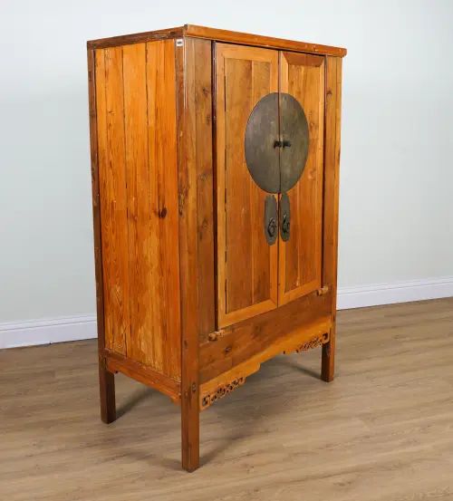 A CHINESE PINE TWO DOOR SIDE CUPBOARD