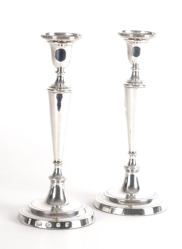 A PAIR OF SILVER TABLE CANDELSTICKS