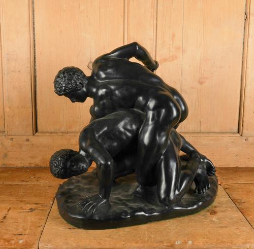 OF GRAND TOUR INTEREST: A BLACK PAINTED PLASTER MODEL OF THE UFFIZI WRESTLERS