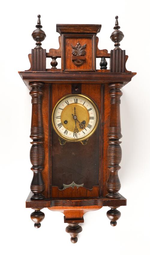 A LATE VICTORIAN WALNUT STRIKING WALL CLOCK