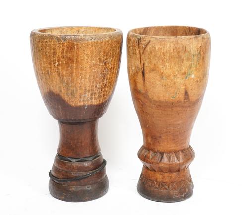 A MATCHED PAIR OF TRIBAL HARDWOOD URNS (2)