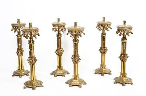 A GROUP OF SIX SPANISH BRASS ‘MODERNISTA’ CANDLESTICKS (6)