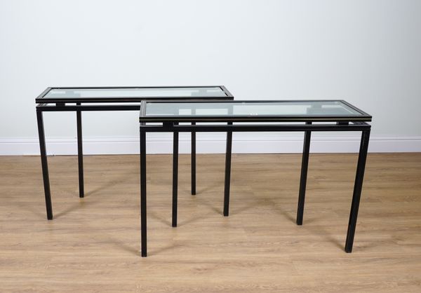 PIERRE VANDEL PARIS; A PAIR OF BRASS INLAID BLACK METAL AND SMOKED GLASS RECTANGULAR CONSOLE TABLES (2)