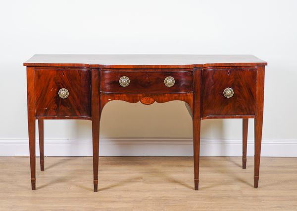 A GEORGE III MAHOGANY BREAKFRONT SIDEBOARD