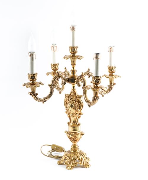 ADDED TO LINE 1 FOR RE-OFFER JAN 24. AN ITALIAN ROCOCO STYLE GILT BRASS FIVE LIGHT CANDELABRUM