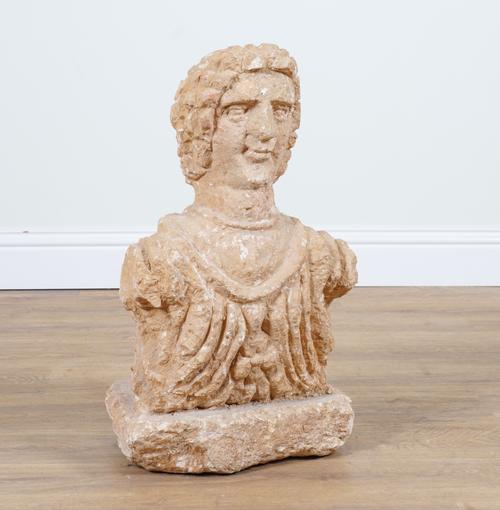 A CARVED STONE HEAD AND SHOULDERS BUST OF A MAN