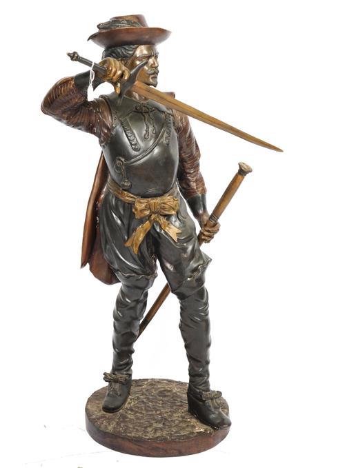A LARGE VARI-COLOURED METAL ALLOY FIGURE OF A CAVALIER
