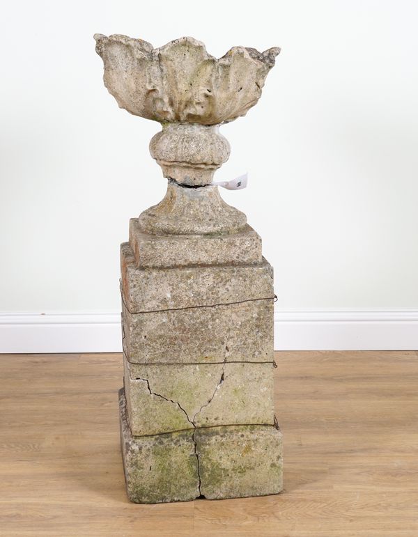 A LATE 19TH CENTURY COMPOSITION STONE URN ON PEDESTAL