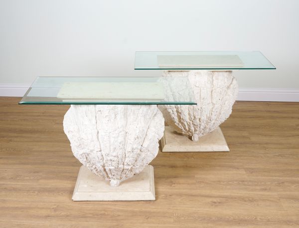 A PAIR OF CONSOLE TABLES WITH GLASS TOPS AND SCALLOP SHELL BASES (2)