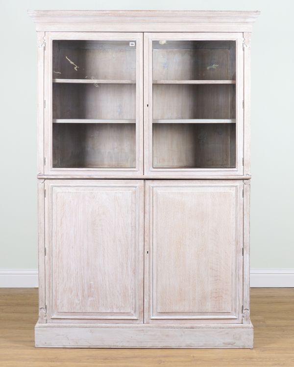 A VICTORIAN LIMED OAK FLOOR STANDING BOOKCASE CABINET