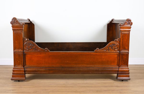 A 19TH CENTURY FRENCH CARVED OAK SINGLE BED