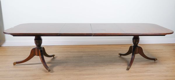 A REGENCY STYLE MAHOGANY D-END DINING TABLE