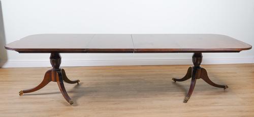 A REGENCY STYLE MAHOGANY D-END DINING TABLE