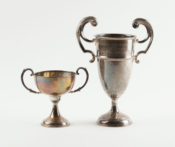 TWO SILVER TWIN HANDLED TROPHY CUPS