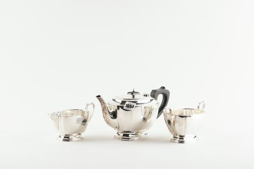 A SILVER THREE PIECE TEA SET